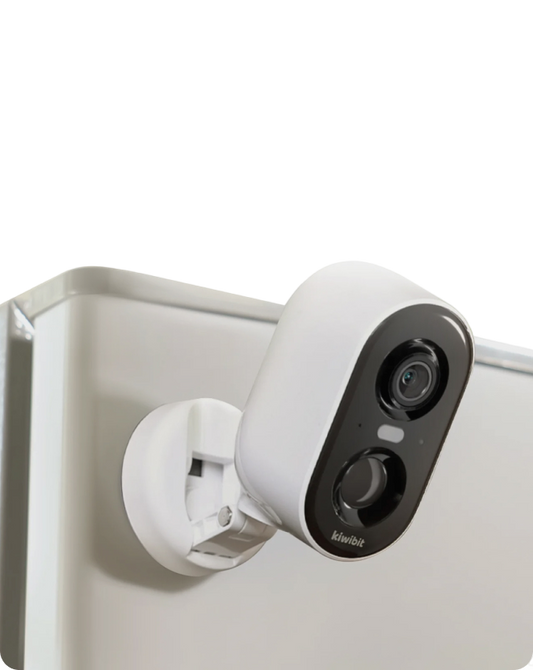 Kiwibit smart battery camera magnetically mounted on metal surface for home security.